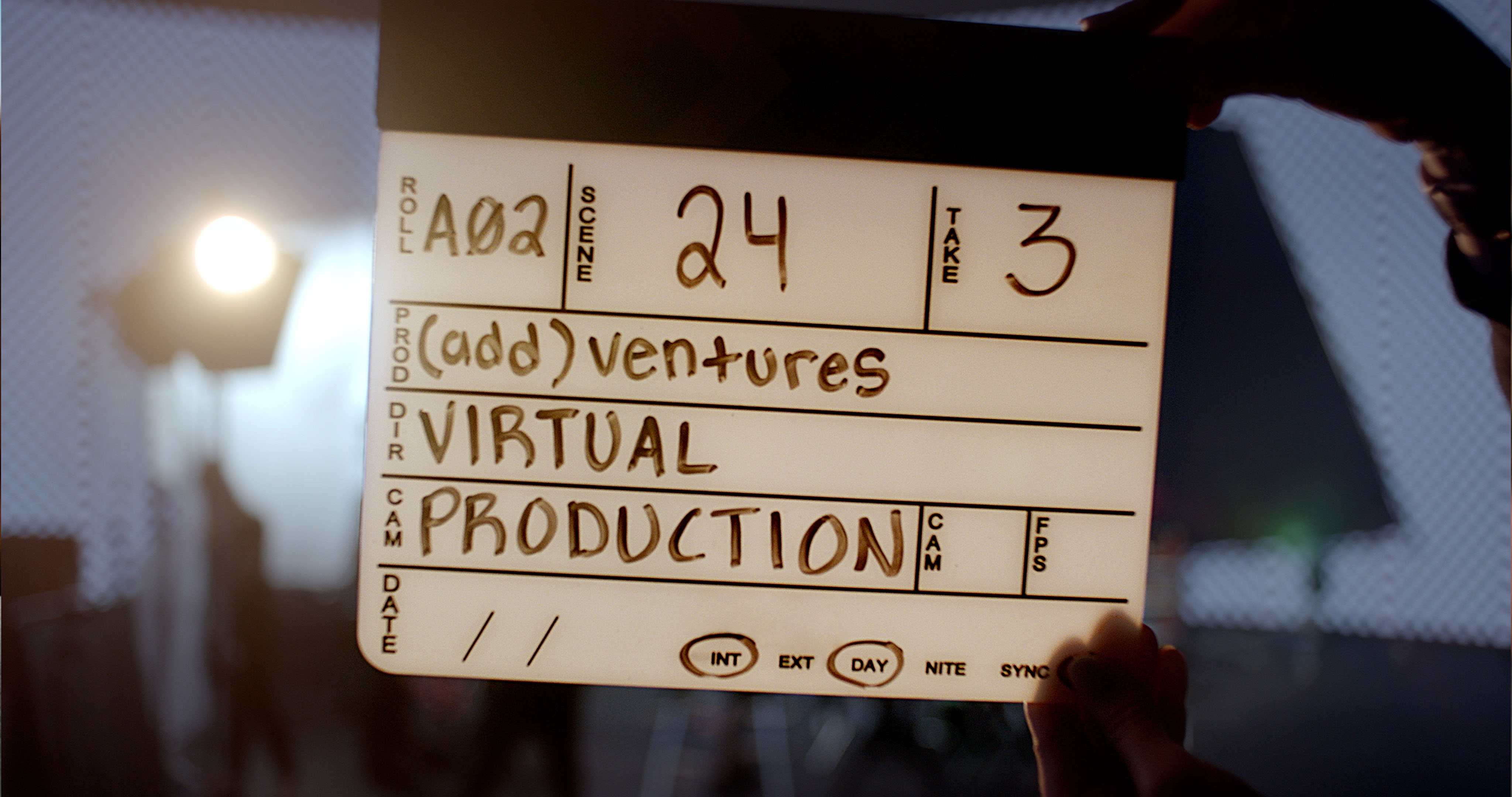 A video marker identifying (add)ventures VIRTUAL PRODUCTION