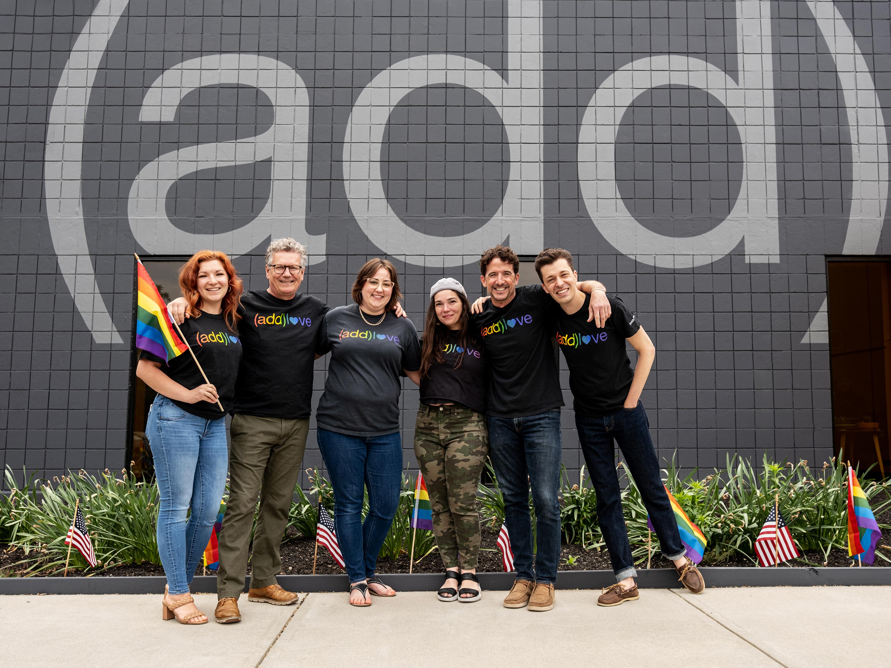 (add)venturists pose outside of HQ in their (add)love shirts for PRIDE.